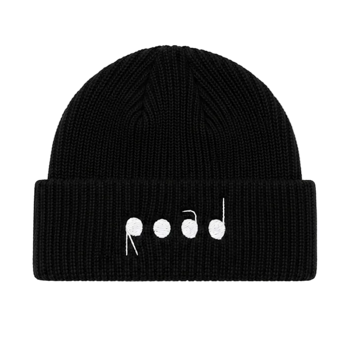 A black ribbed knit beanie hat with a folded cuff, featuring a white embroidered graphic of stylized lowercase letters on the front, set against a plain white background.